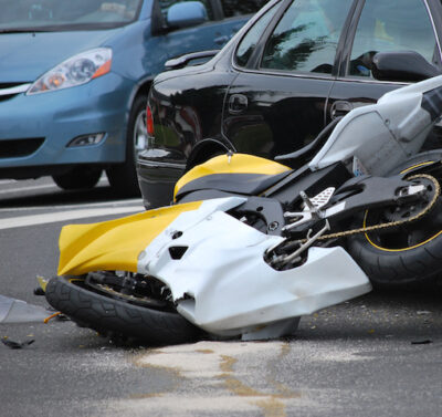 Motorcycle totaled after collision with car
